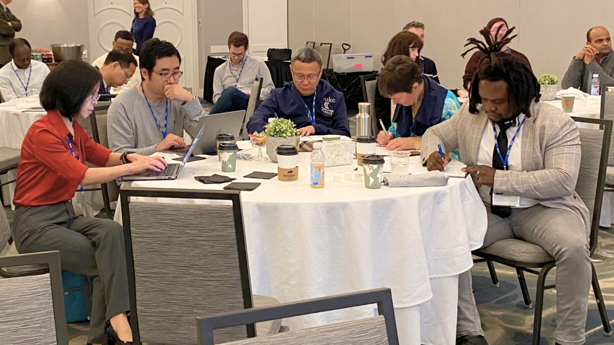 faculty participating in writing exercise at table