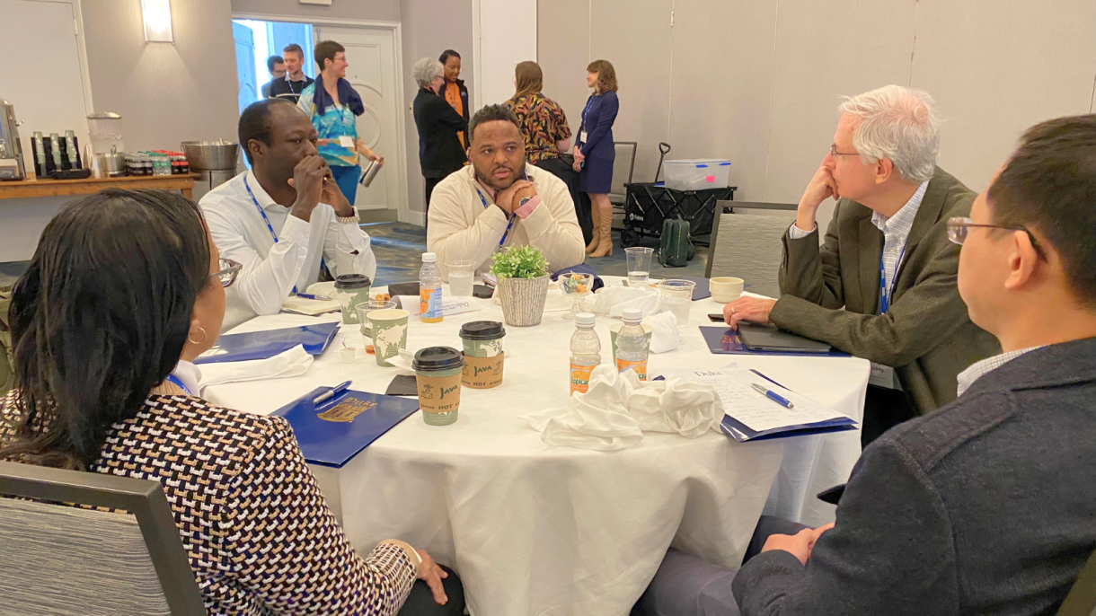 faculty discussing tenure journey at their table