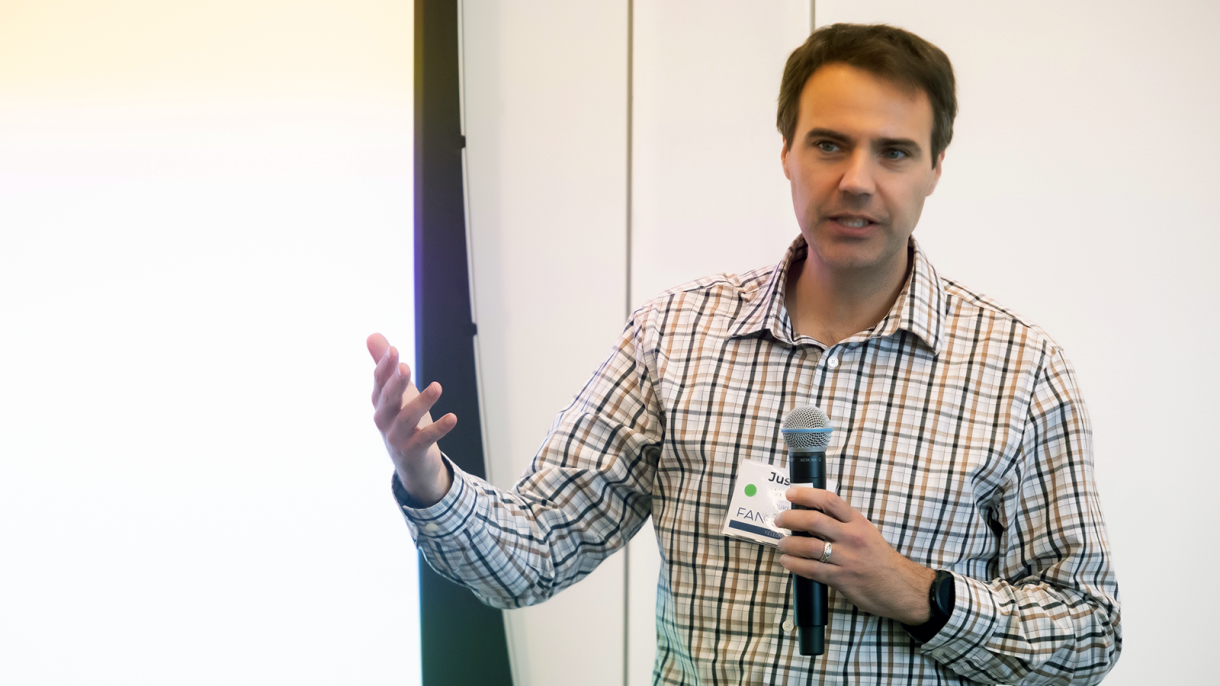 A man with a mic speaks