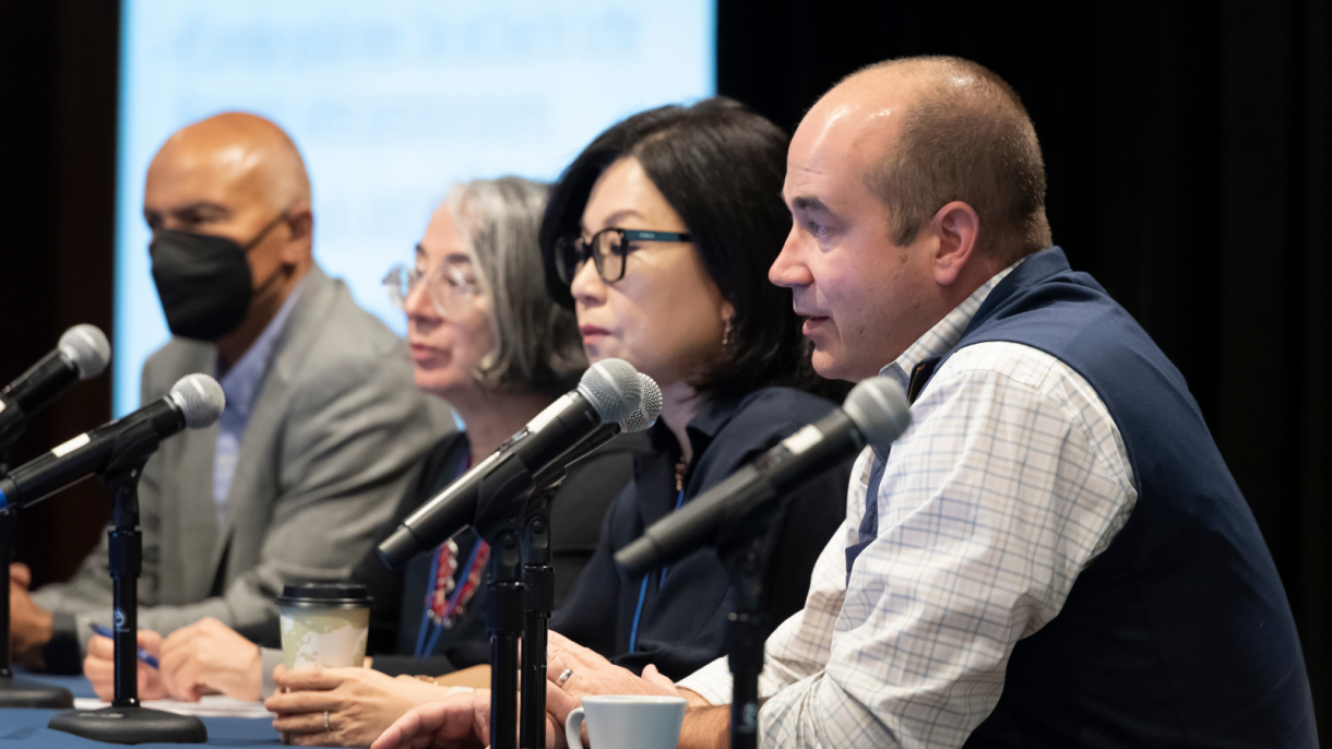 Three faculty members on the panel, with Abbas Benmamoun as moderator.